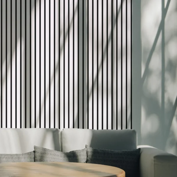 Wall with a white acoustic panel and a sofa